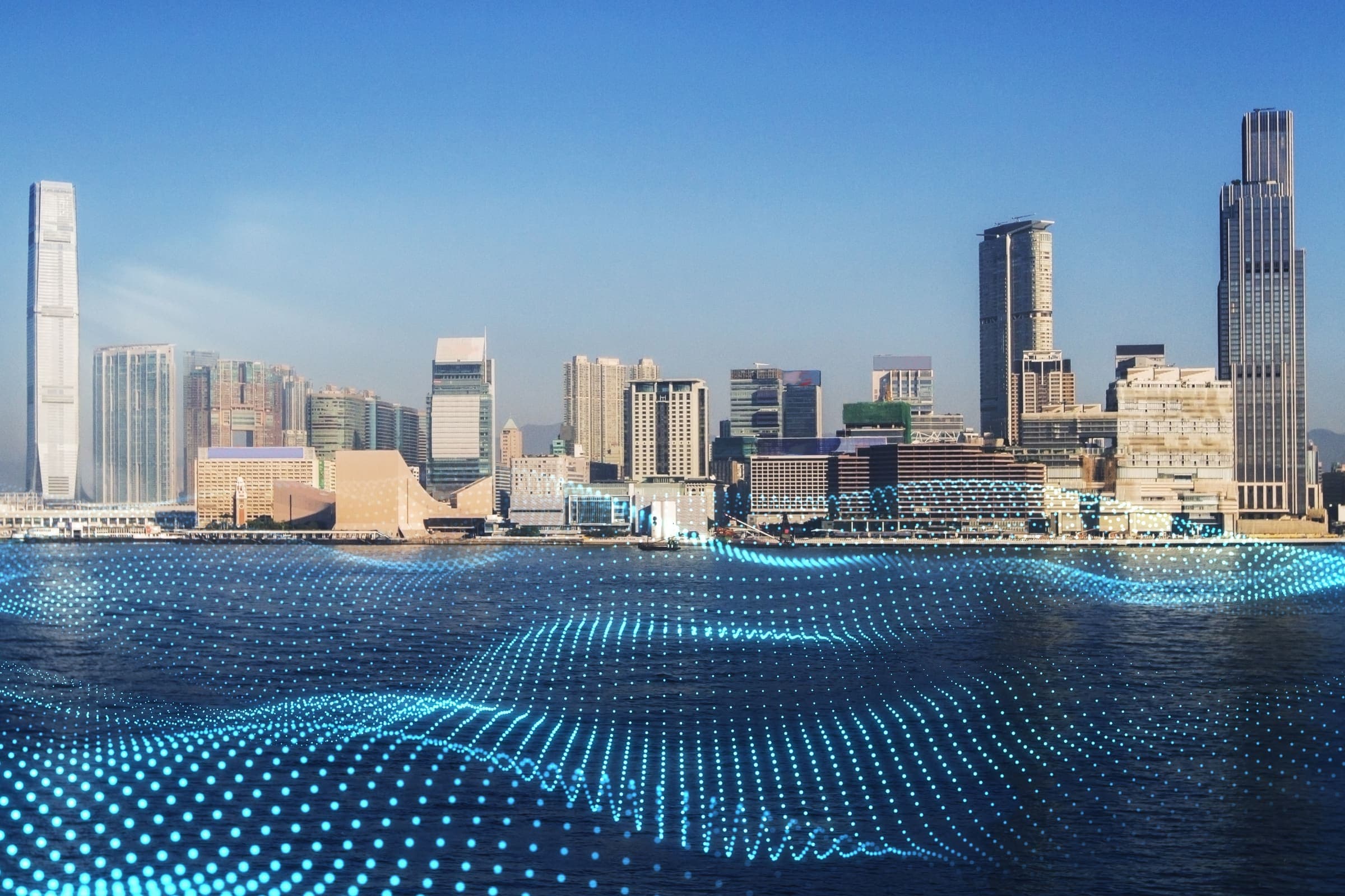 City skyline across a harbour overlaid with flowing data points