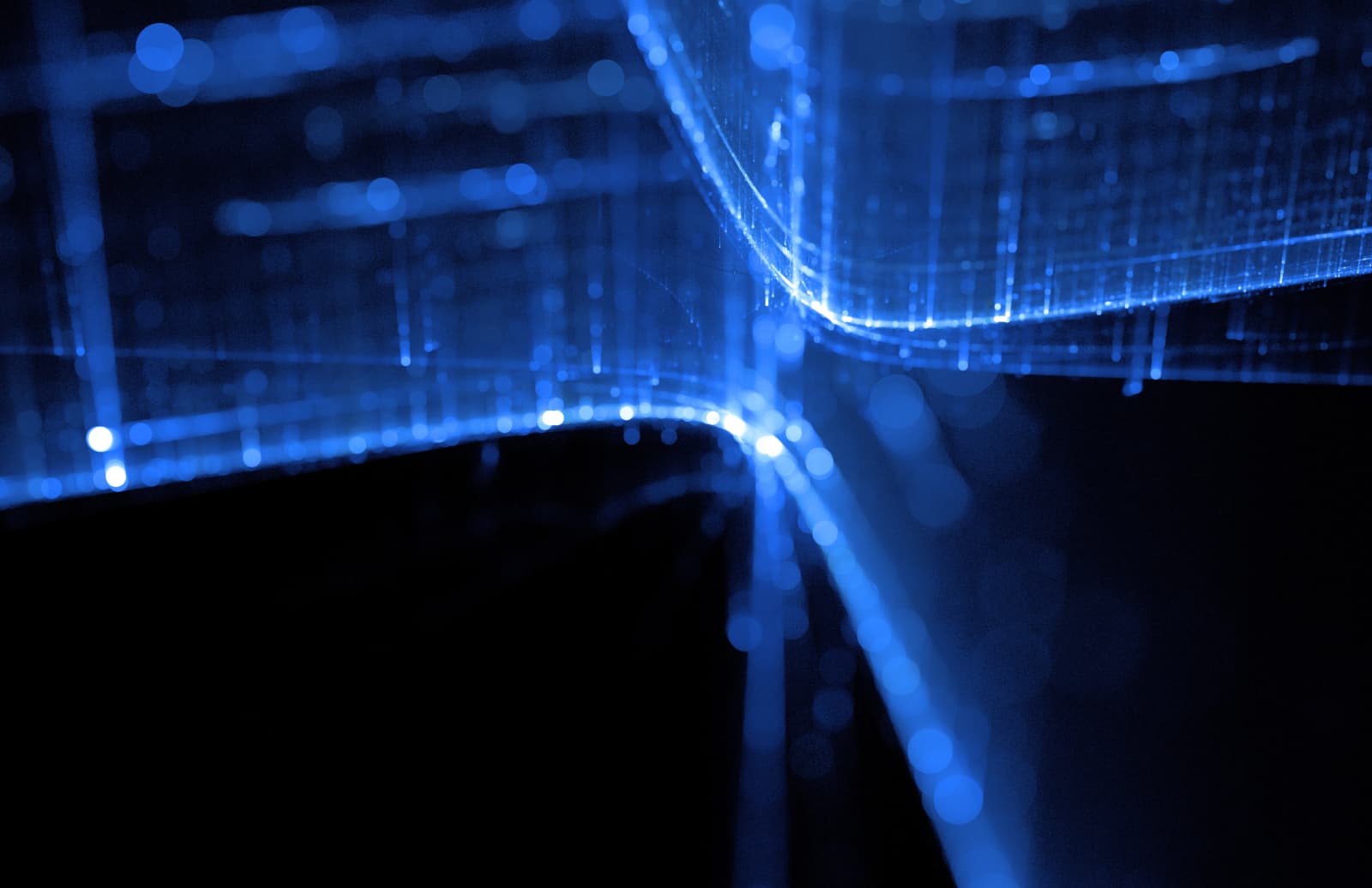 Streams of blue light flowing through a data network