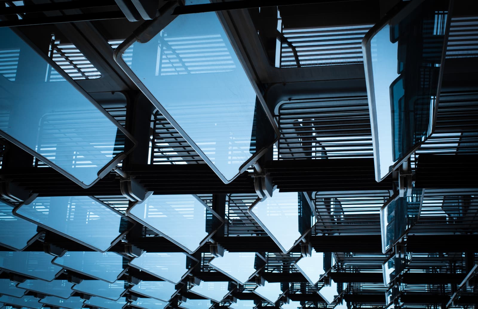 Steel and glass stairways seen from below